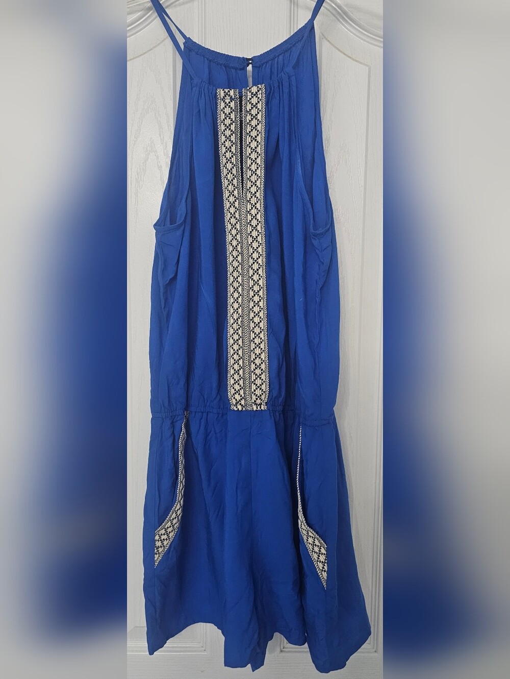 I.N. San Francisco blue halter romper features a bohemian-inspired embroidered